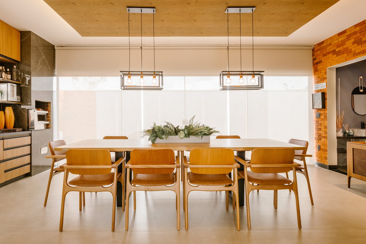 Services A stylish dining area featuring modern furniture, wooden accents, and minimalist design.