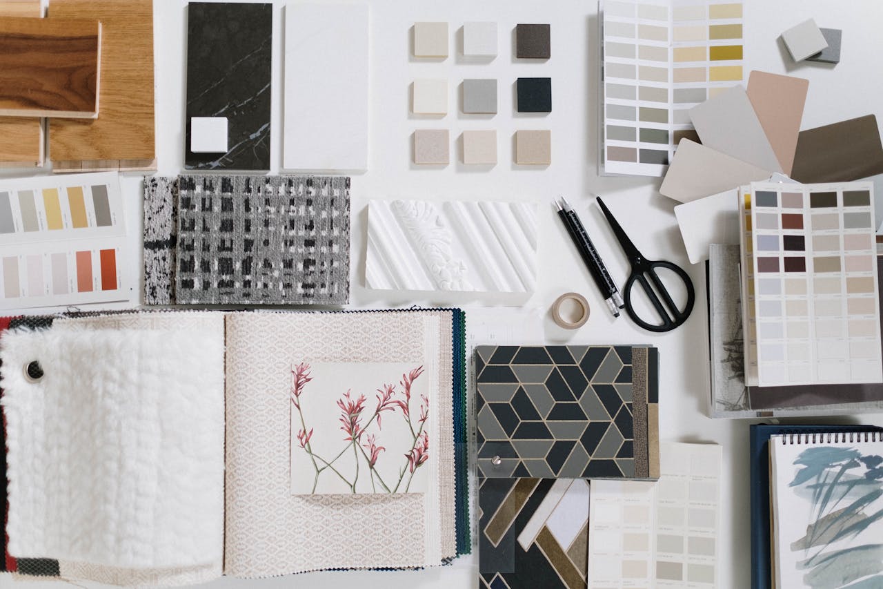 Services A flat lay of interior design samples showcasing textures and colors for creative inspiration.